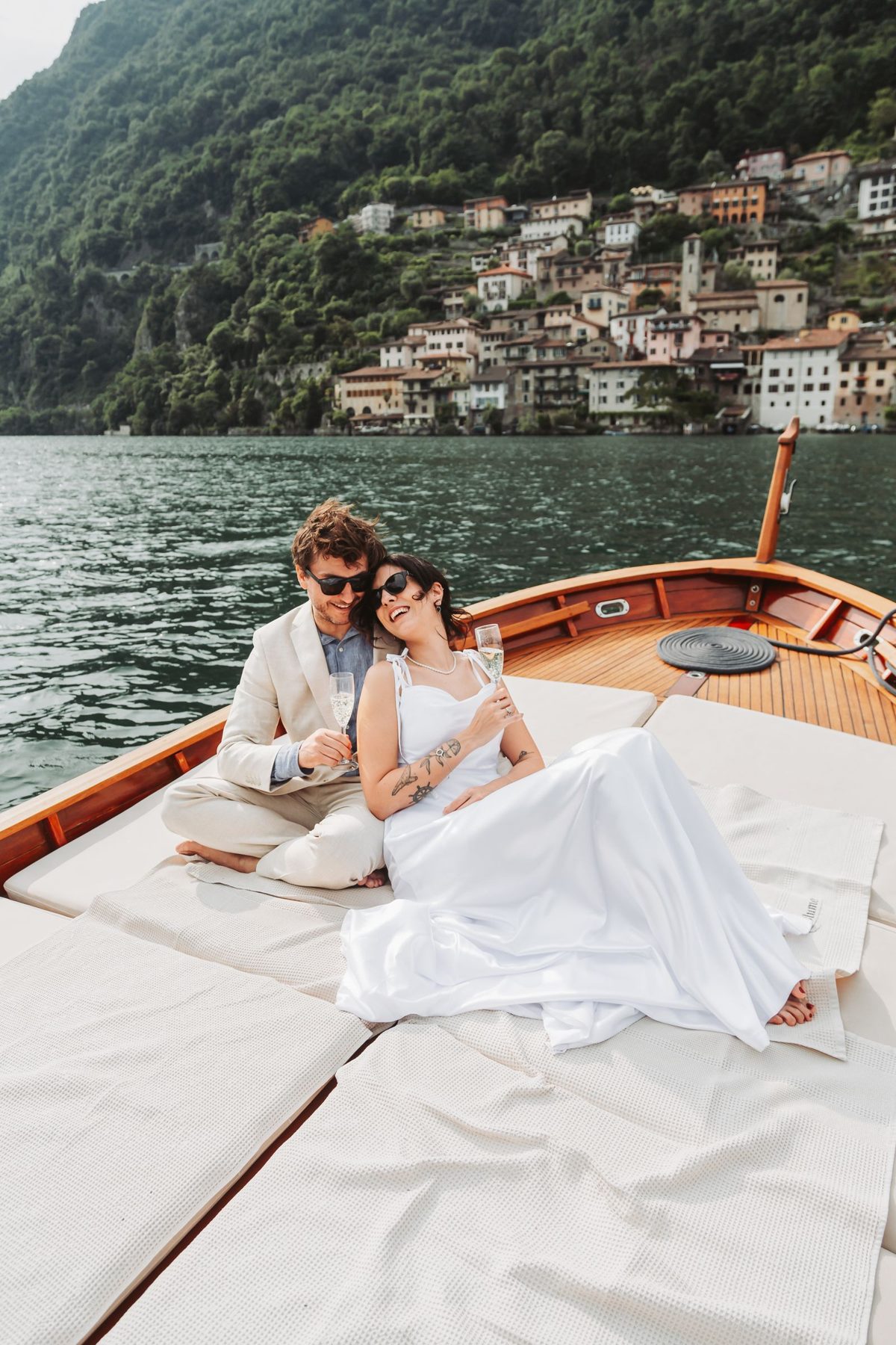 Romantic couple relaxing on a lake boat. Photo by Image Hunter