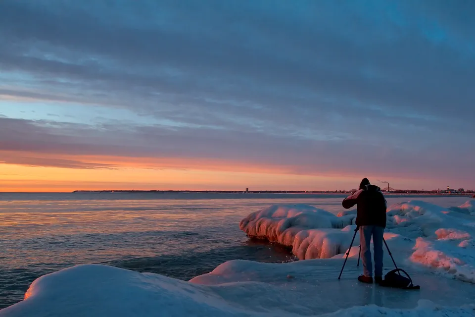 Photographing sunrise, Lake Michigan, USA